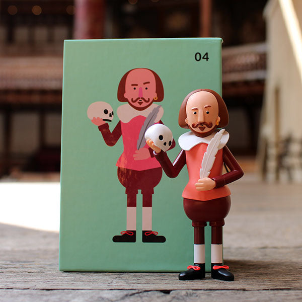 Figurines of Shakespeare holding skulls against a green background