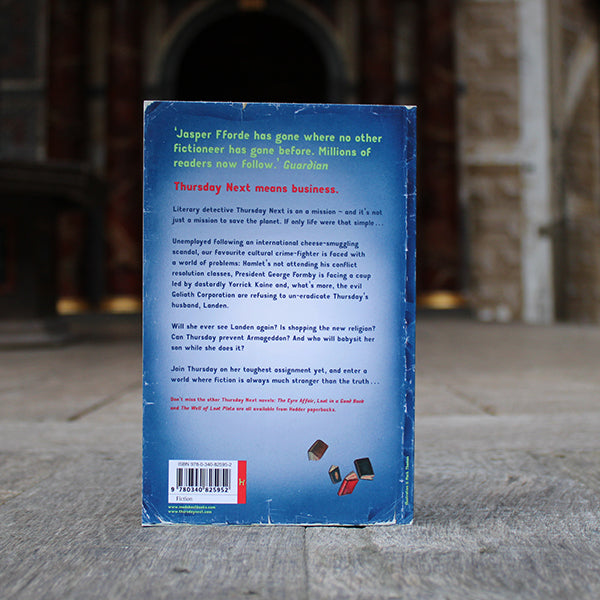 Royal blue paperback book with neon green and red writing