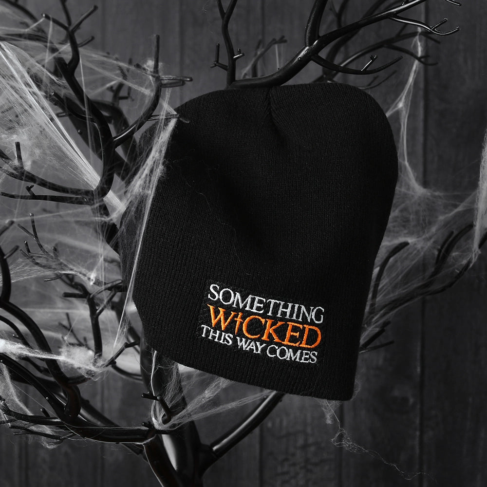 Black beanie hat with an embroidered quote on the front from Shakespeare play, Macbeth,