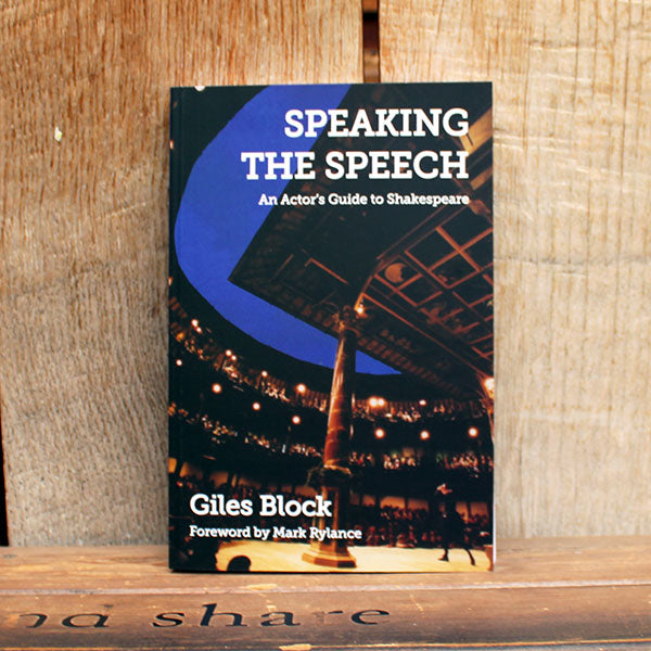Book titled 'Speaking the Speech' by Giles Block on a wooden surface