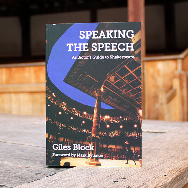 Book titled 'Speaking the Speech' by Giles Block on a wooden surface with a blurred background
