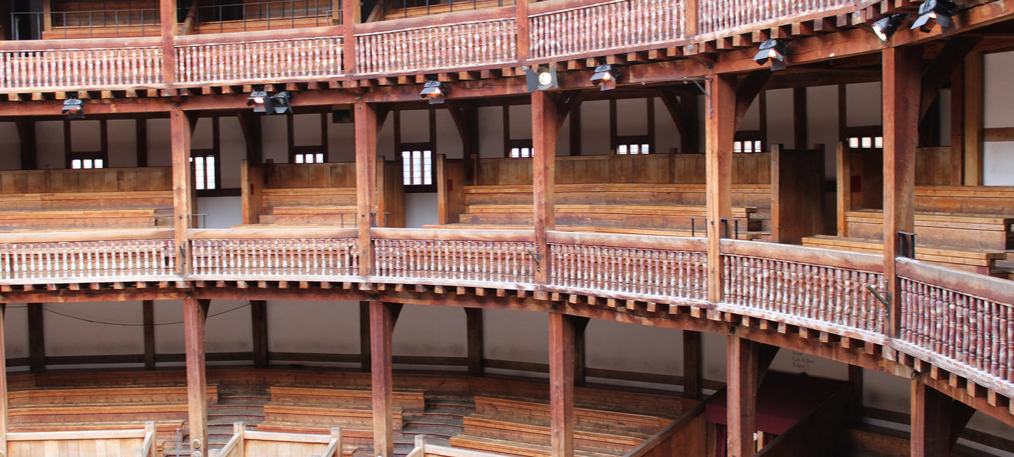 Image of the Globe theatre interior showing the three tiers of seating from the right side of the stage
