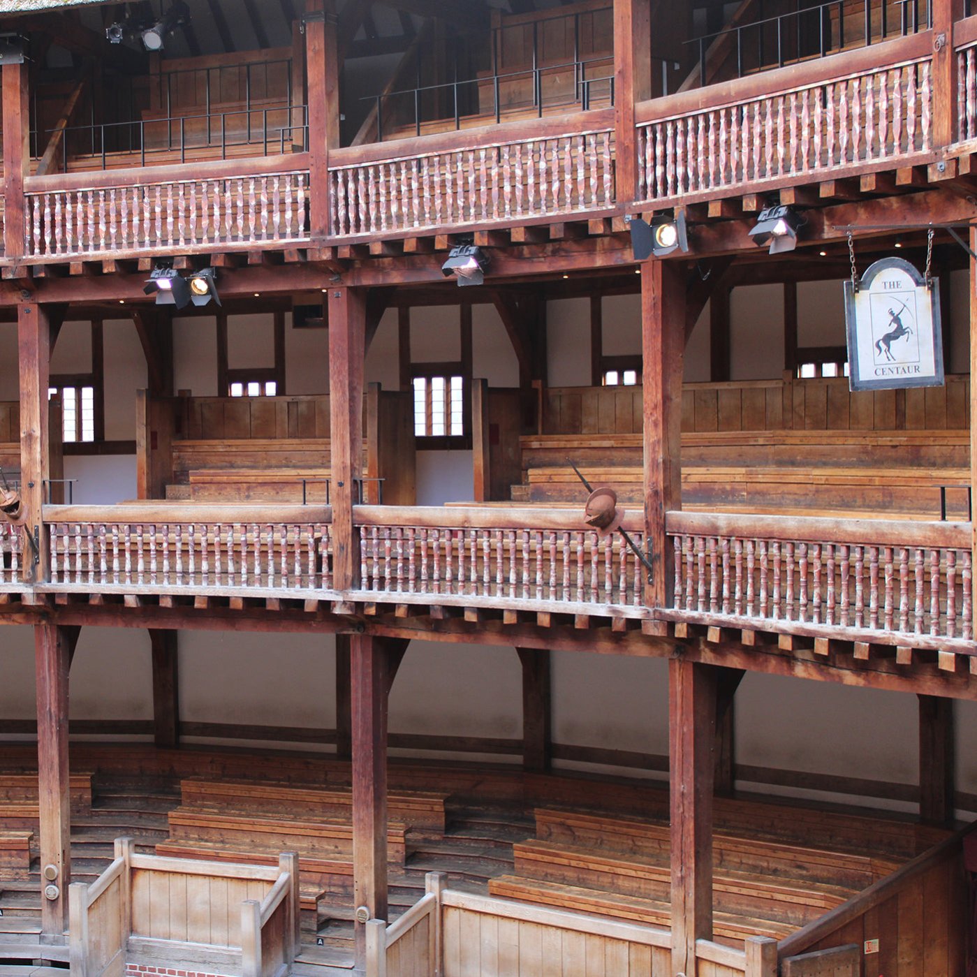 Image of the Globe theatre interior showing the three tiers of seating from the right side of the stage