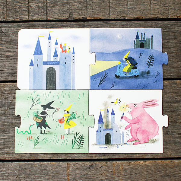 Children's puzzle with illustrated scenes of a castle, a rabbit, and other characters on a wooden surface.