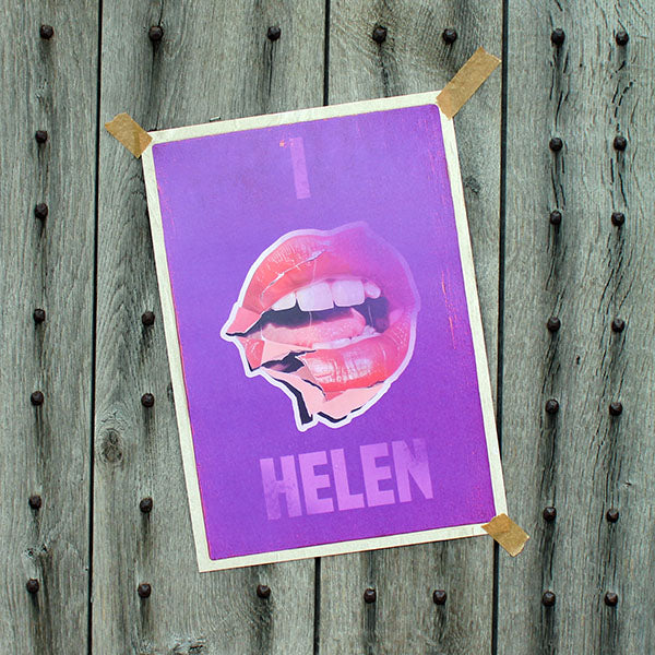 Art print with a graphic of lips and the name 'Helen' on a wooden background