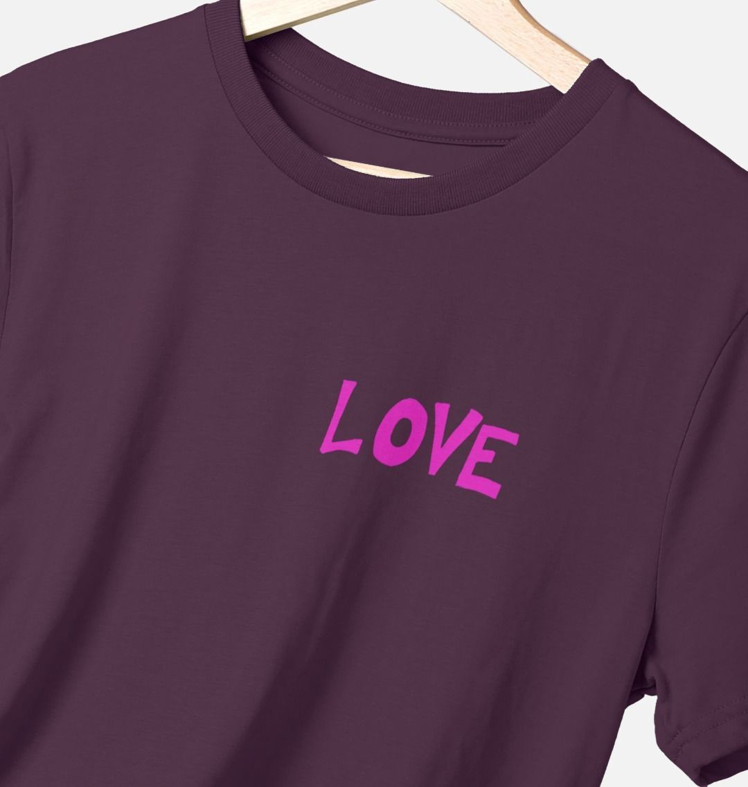Purple t-shirt with hot pink graphic style quote text on upper left chest