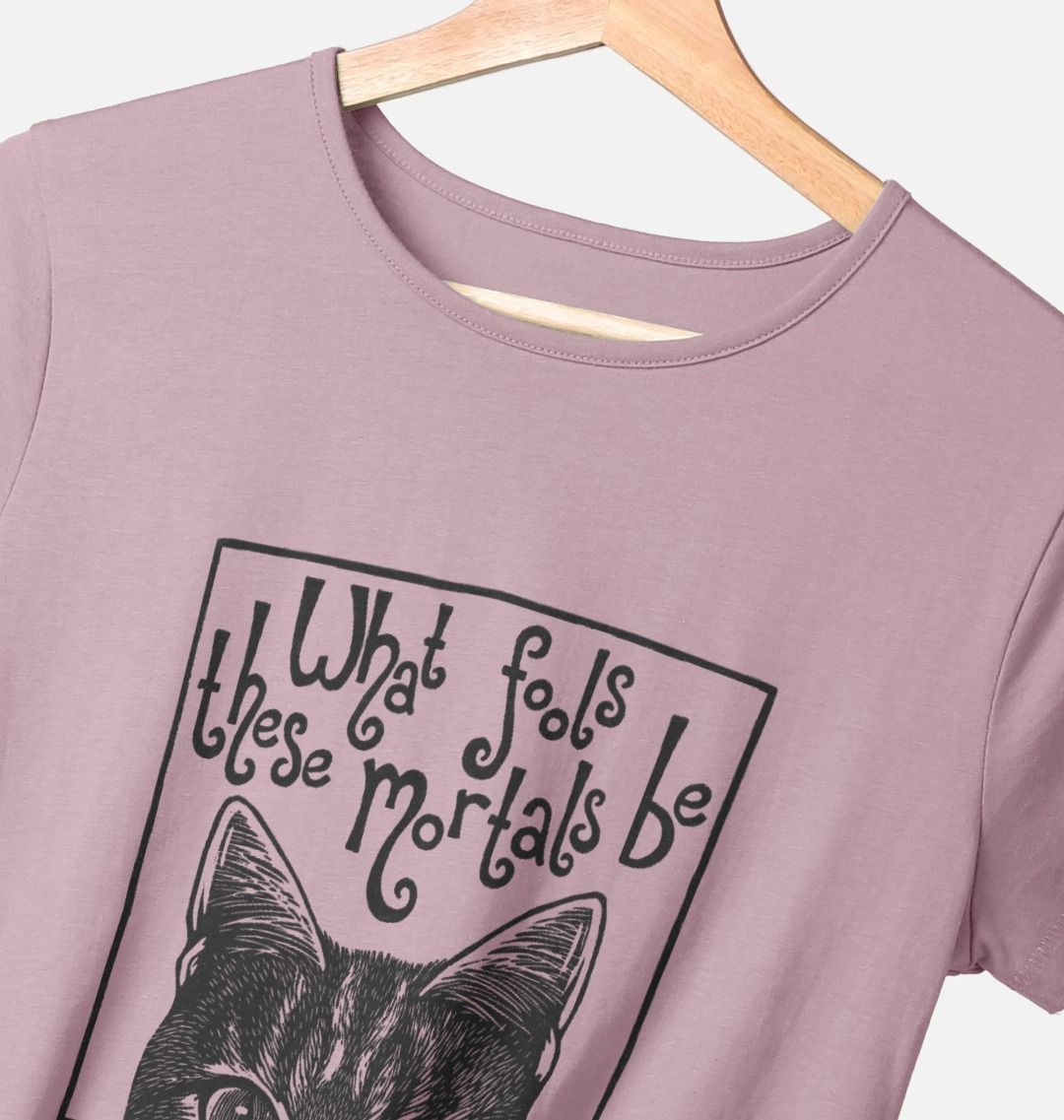 Mauve t-shirt with a black cat graphic and text on a hanger