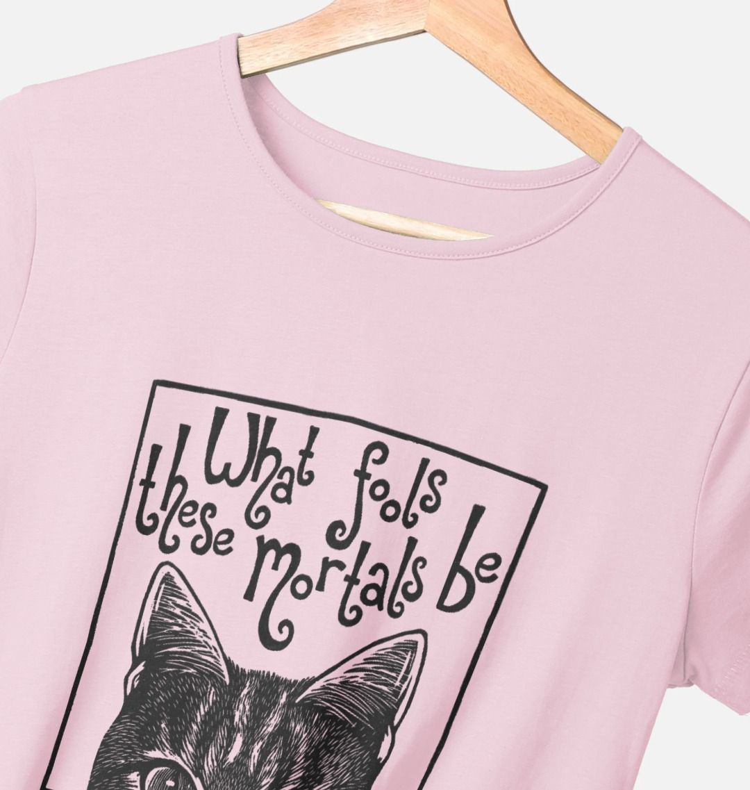 Pink t-shirt with a black cat graphic and text on a hanger