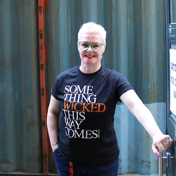Black cotton crew neck, short sleeve t-shirt with a quote from Shakespeare play, Macbeth printed on the chest.