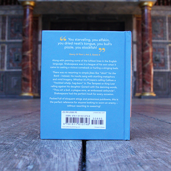 Hardback book with a blue cover on a wooden surface