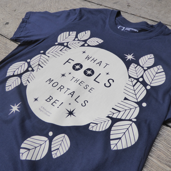 Navy blue cotton short sleeve t-shirt with white graphic text in centre
