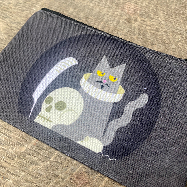 Grey cotton purse with black zipper on top and black circular graphic on the centre front and back with Shakespeares cat