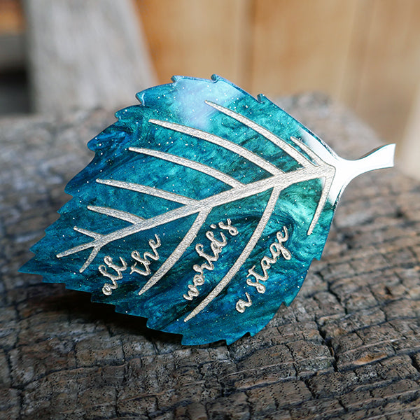 Jewel green leaf brooch with gold engraved text