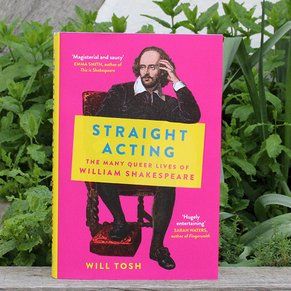 Hot pink hardback book with yellow text blocks and blue writing with drawing of William Shakespeare seated