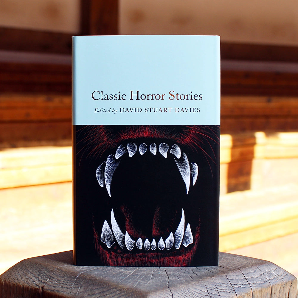 
                  
                    Small hardback book with an image of fangs on the cover
                  
                