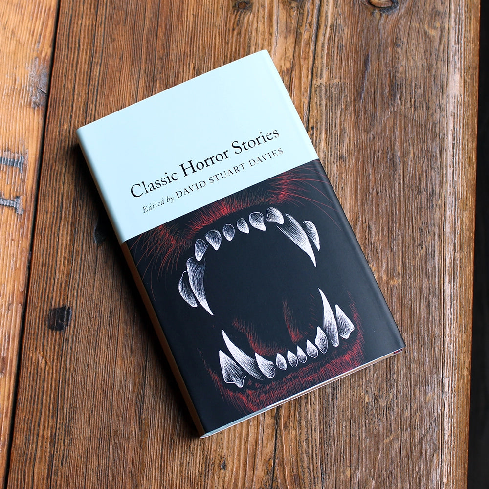 Small hardback book with an image of fangs on the cover