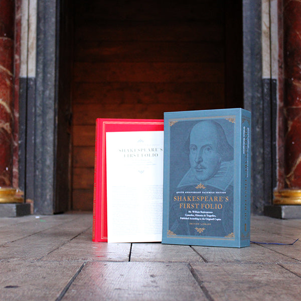 Red hardback book with blue hard slip case with image of William Shakespeare and gold and white text