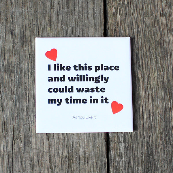White square magnet with a quote in black letters and red hearts