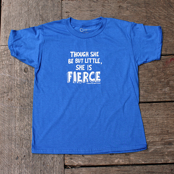 Royal blue children's t-shirt with a white print on a wooden background