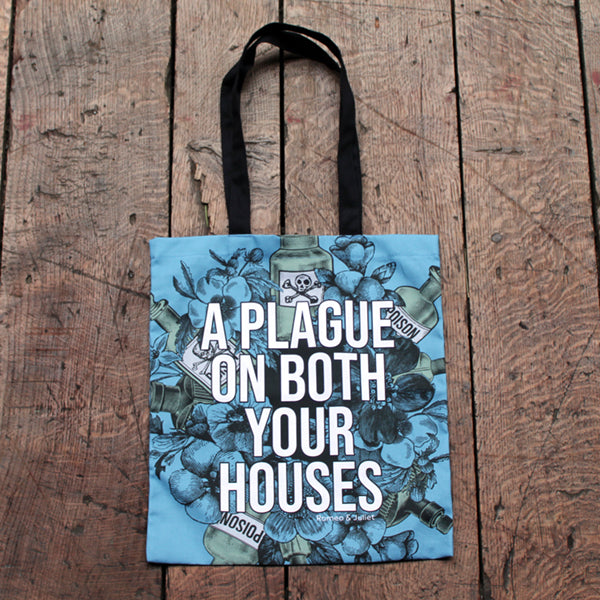 
                      
                        Powder blue cotton tote bag with two black handles, covered in gothic floral motif, with poison bottles, and white graphic text in centre
                      
                    