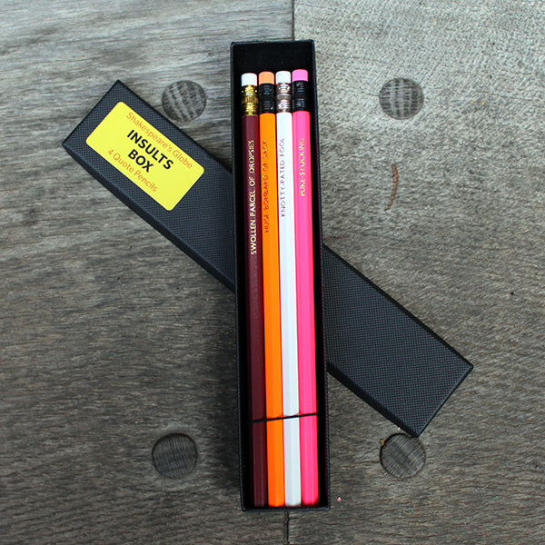 Four brightly coloured pencils with erasers in a black gift box