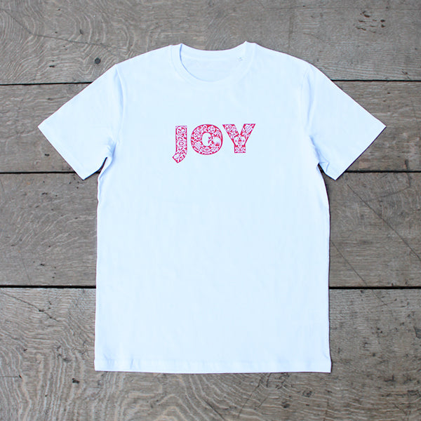 
                  
                    white t-shirt with a red patterned text print on the chest that reads JOY
                  
                