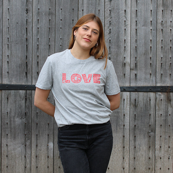 
                  
                    Grey heathered unisex tshirt with bold red graphic text across chest depicting LOVE
                  
                