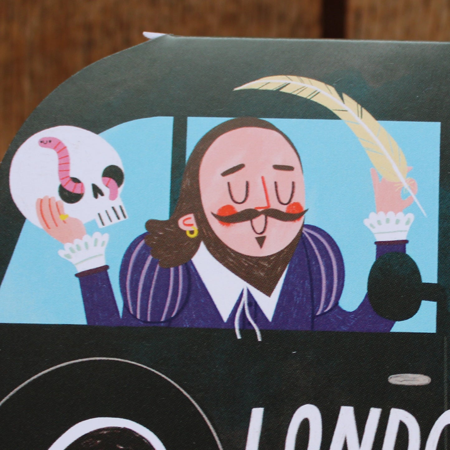 Greetings card shaped like a black London taxi with Shakespeare as a passenger