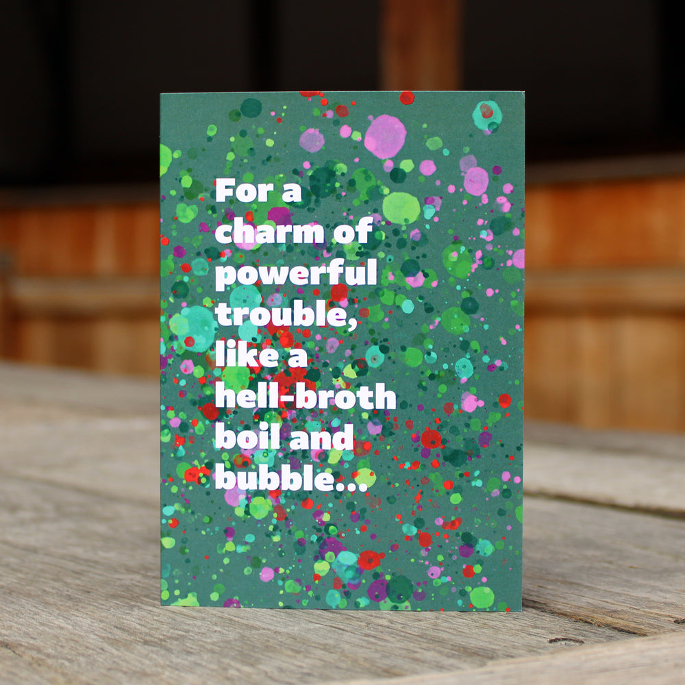 Green greetings card with colourful bubble patterns and a quote in white 