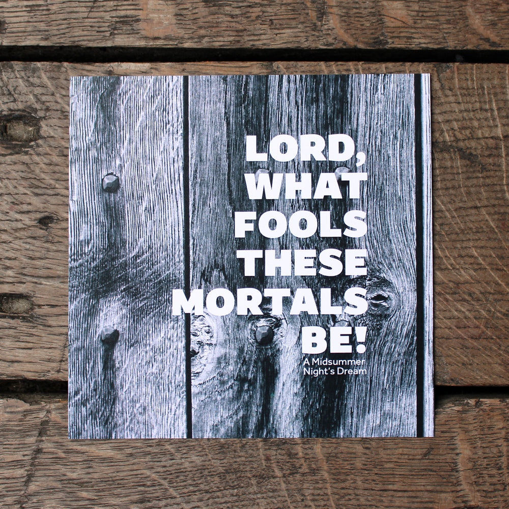 Square print of grey wood-grain with a quote in white lettering over the top