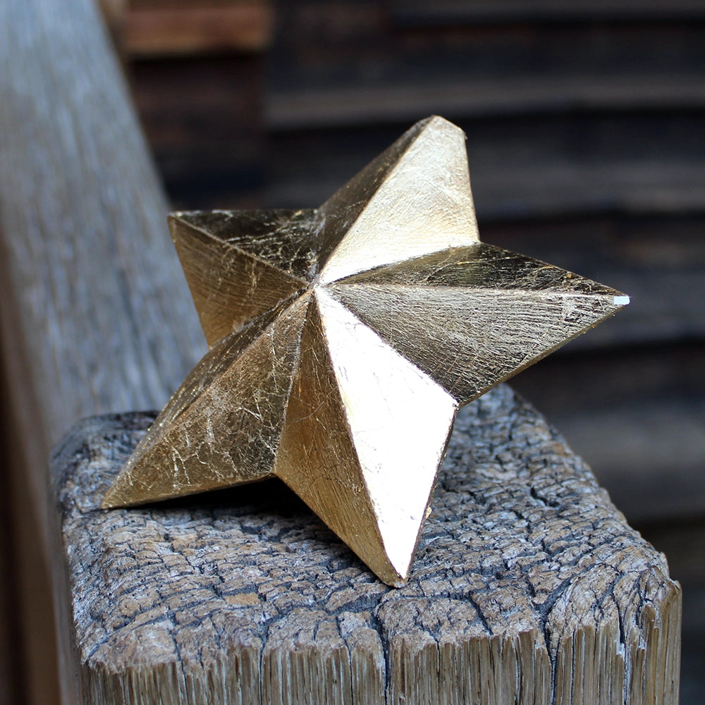 
                      
                        five-pointed plaster star covered in gold leaf
                      
                    