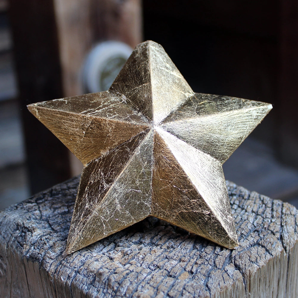 
                      
                        five-pointed plaster star covered in gold leaf
                      
                    