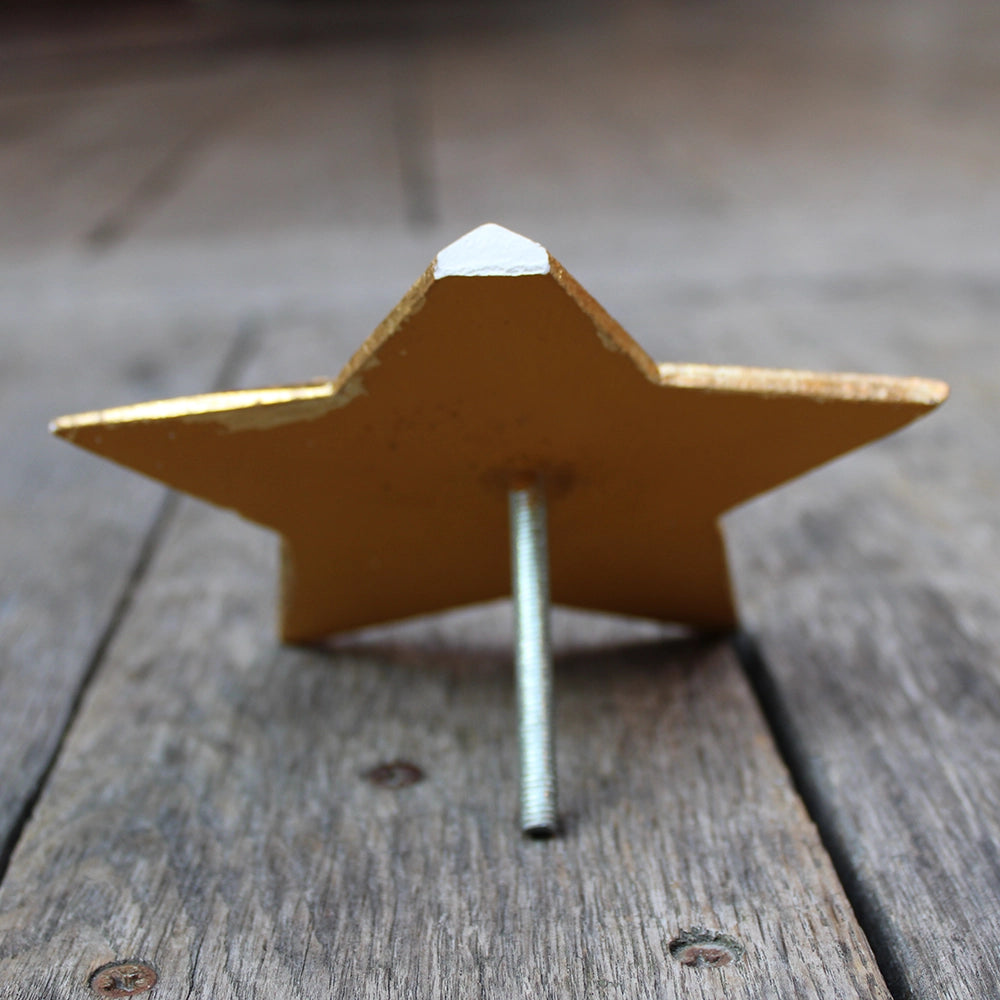 
                      
                        five-pointed plaster star covered in gold leaf
                      
                    