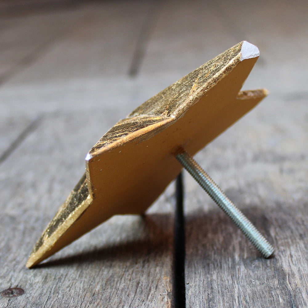 
                      
                        five-pointed plaster star covered in gold leaf
                      
                    