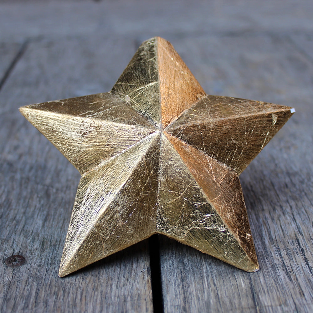 
                      
                        five-pointed plaster star covered in gold leaf
                      
                    