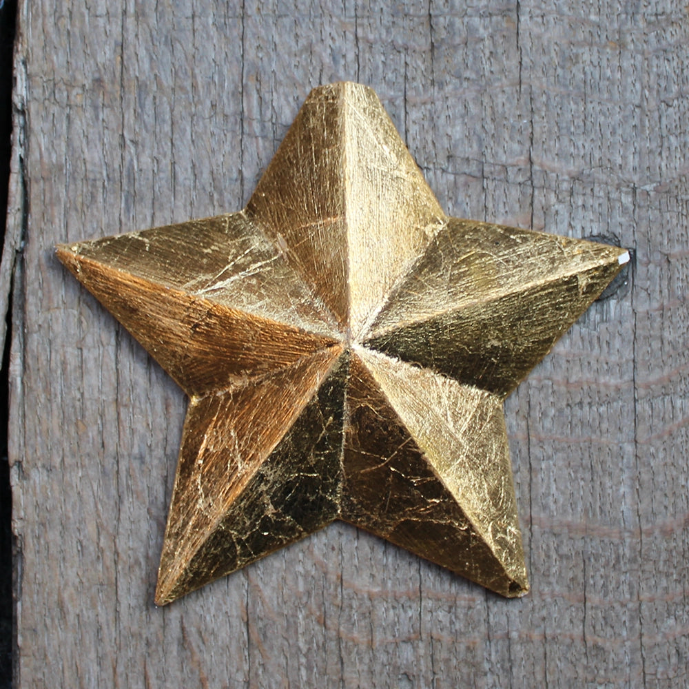 five-pointed plaster star covered in gold leaf