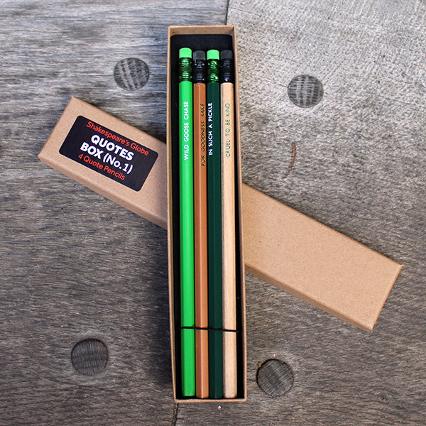 Four green and gold pencils with erasers in a kraft gift box