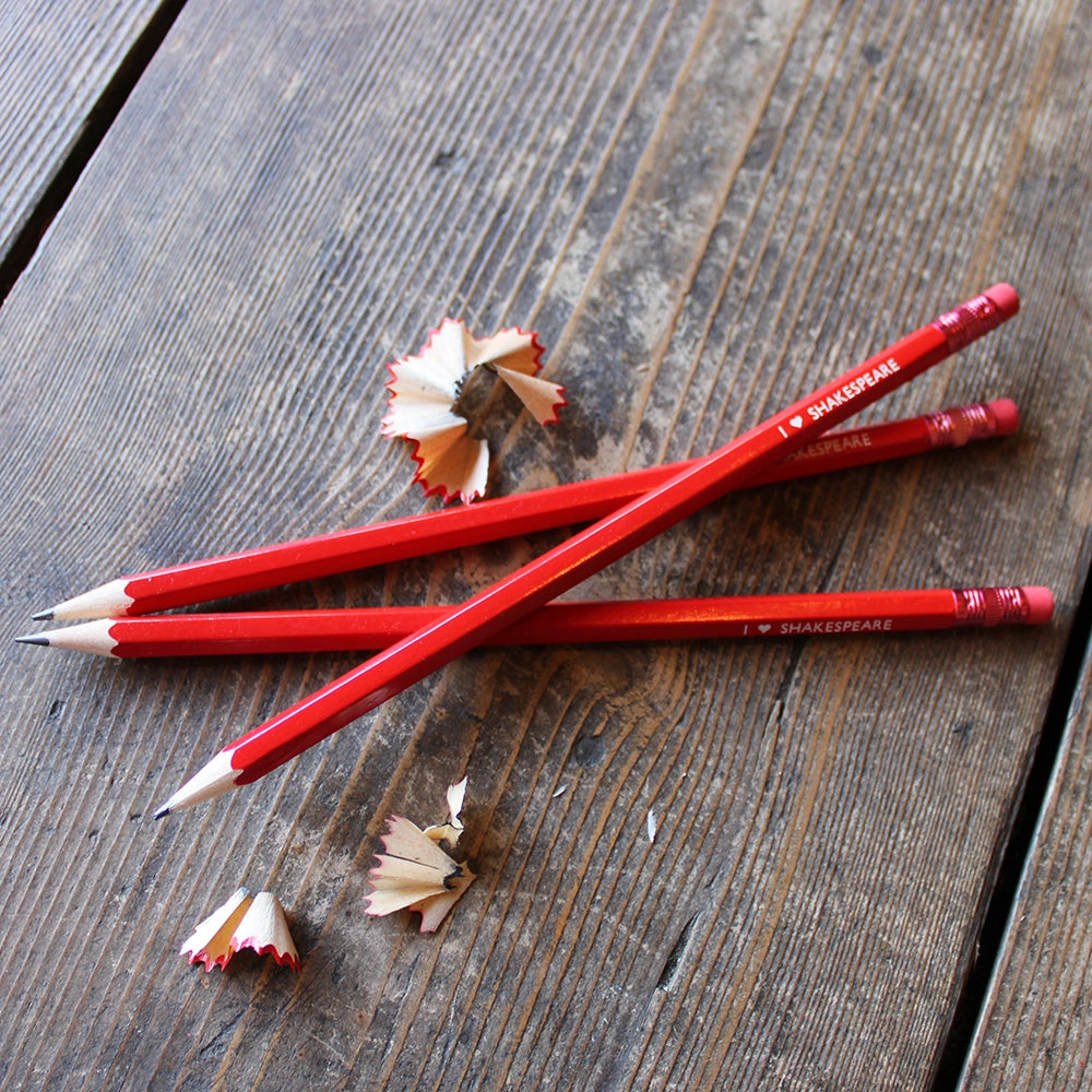 Red pencils with red erasers and white stamped text