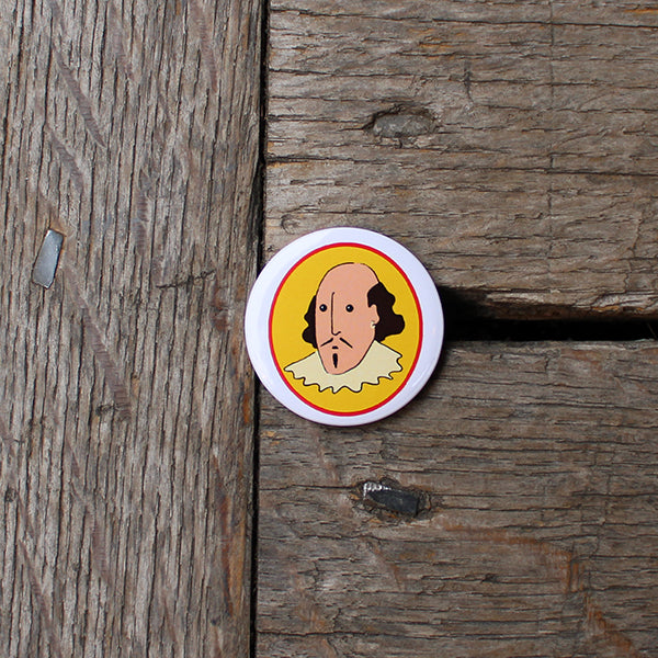 White circular button badge with cartoon Shakespeare in centre