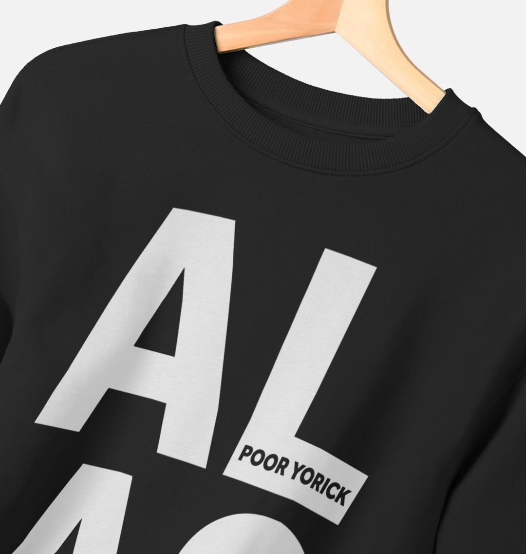 White oversized block text spelling A L  A S on an oversized black sweatshirt