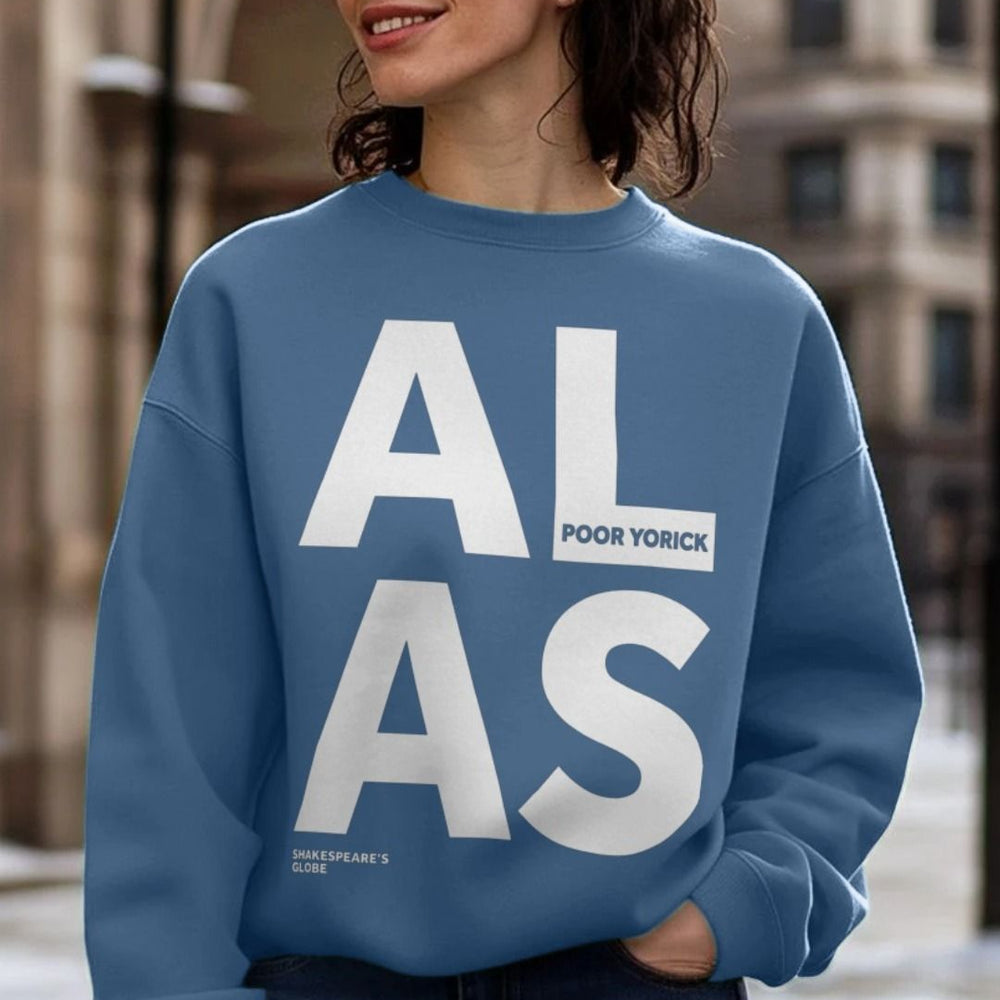 
                  
                    White oversized block text spelling A L  A S on an oversized blue sweatshirt
                  
                