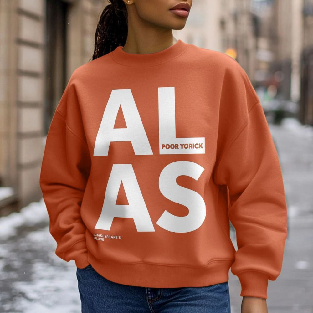 White oversized block text spelling A L  A S on an oversized orange sweatshirt