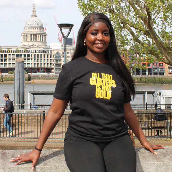Black cotton t-shirt with gold graphic text in centre front
