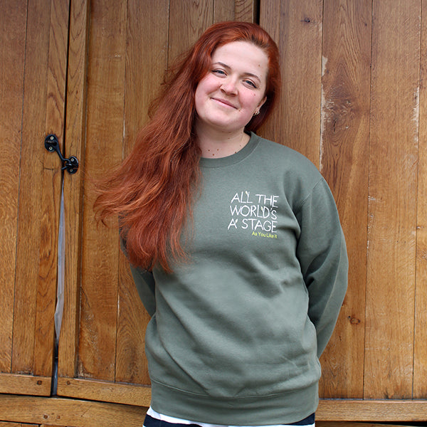 Sage green cotton sweatshirt with 'All The World's a Stage' quote on left breast.