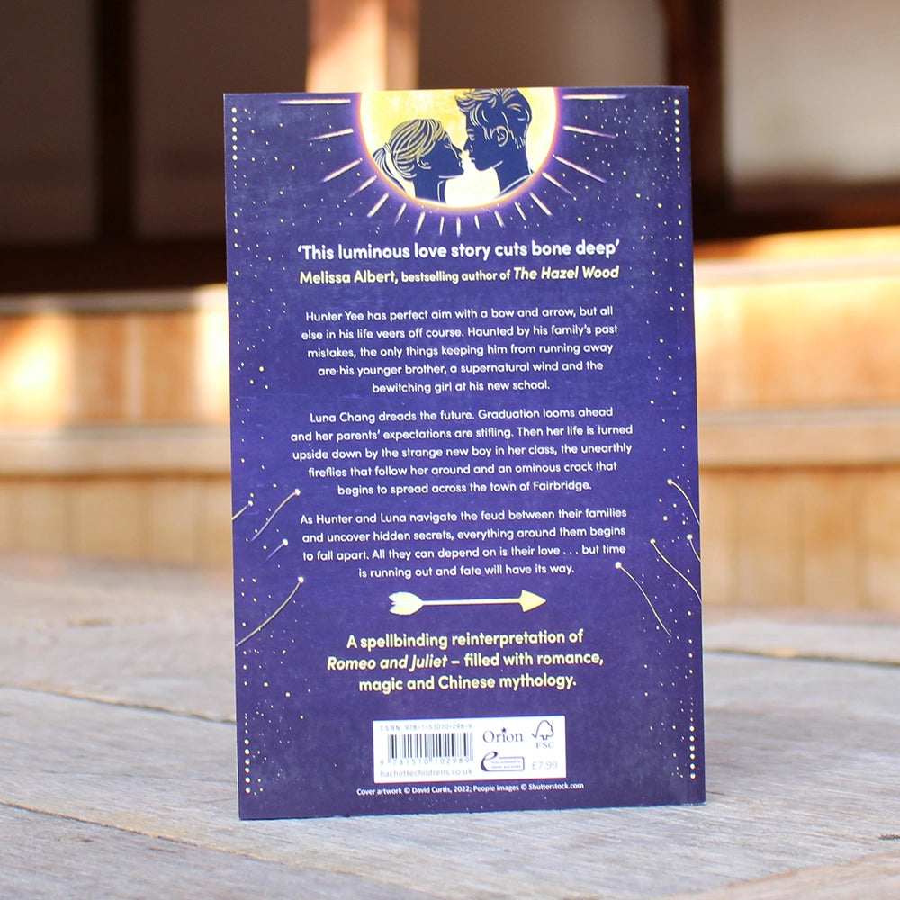 
                      
                        Navy blue paperback book with sun with 2 figures at the top and bold white writing
                      
                    