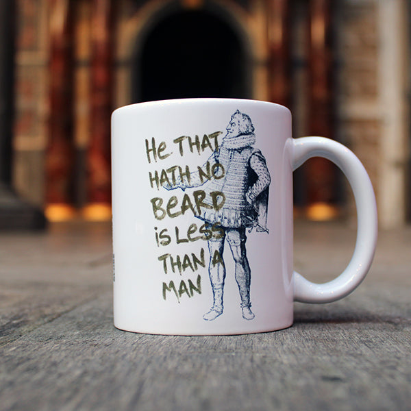 White ceramic mug with black graphic drawing of Shakespearean man with gold text overlayed