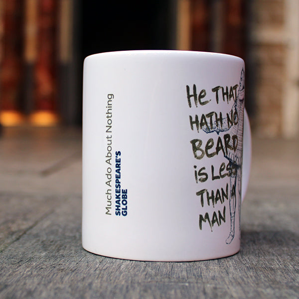 White ceramic mug with black graphic drawing of Shakespearean man with gold text overlayed