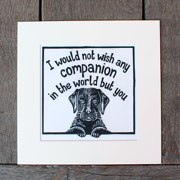 
                      
                        Off white mounted print with black linocut design of black labrador and stylised quote text above
                      
                    