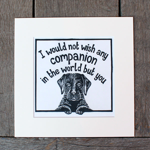 Off white mounted print with black linocut design of black labrador and stylised quote text above