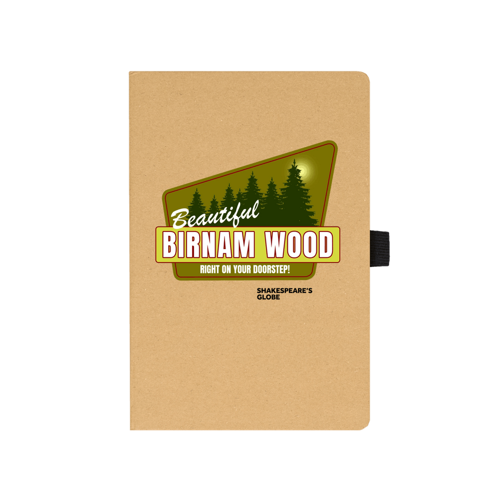 Kraft notebook with yellow and green vintage travel poster image of forest, with white graphic text over top